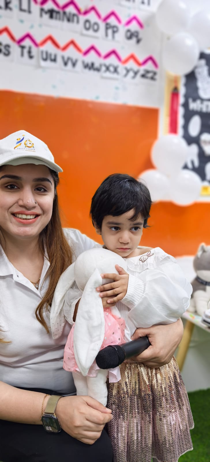 Caring teacher with young child at Angels Garden daycare